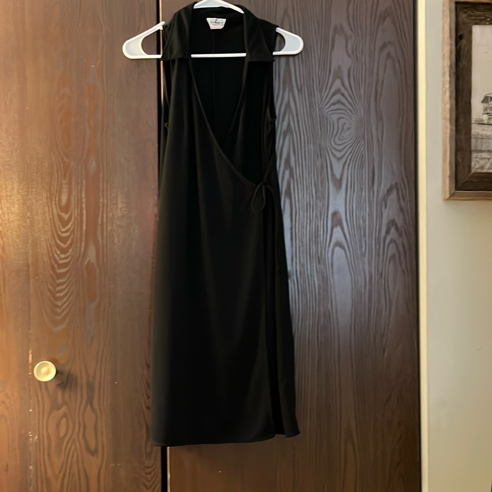 Beware basic black sleeveless wraparound dress. Size Medium.